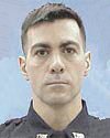 Officer Dominick Pezzulo, 36, New York, N.Y., USA - Officer Dominick Pezzulo was killed in the September 11, 2001, terrorist attacks while attempting to rescue the victims trapped in the World Trade Center. As the South Tower collapsed, Officer Pezzulo and several other officers quickly ran to the building's elevator shaft. Only Officer Pezzulo and two other officers survived the initial collapse, but soon afterwords Officer Pezzulo was stuck by falling debris. The two officers that survived say "Just remember me, I died trying to save you guys," were Officer Pezzulo's last words. He then fired a single shot into the air trying to let the others know where his friends were, and then died. Officer Pezzulo had served with the Port Authority of New York and New Jersey Police Department for 13 months. He is survived by his wife and two young children. Port Authority Police Department..